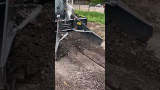 Bobcat Loader working with Asphalt Spreader