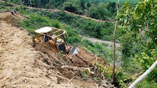 Terrible landslide occurred when Bulldozer D6r Xl cut through a mountain cliff