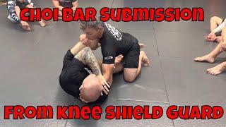 Choi bar submission from knee shield guard