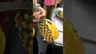 A master's dazzling pineapple cutting skills dripping with juice