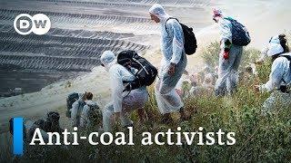German climate activists storm enormous lignite coal mine | DW News