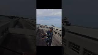 My 16 Y/O stepson hooked up to a HUGE FLYING shark. Florida keys #bridge #fishing #subscribe