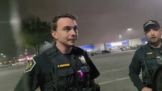 Officer pulls his gun for officer safety since I refused to take my hand out of my pocket