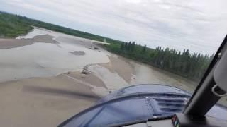 DeHavilland Beaver landing on short gravel bar in Alaska.