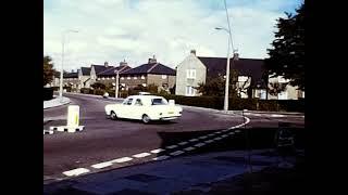 1971 - Old cars speeded up at the junction outside GM Motor Spares, Welling