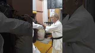 two handed defense against a strong man's attack method of Sensei Takehiro Gaja Uechi ryu Karate