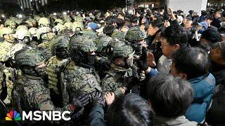 ‘Reverse Jan. 6’: South Koreans help lawmakers scale parliament to save democracy