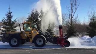 Wille doing bank cutting with a snow blower