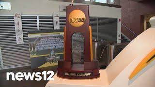 Adelphi men's lacrosse team returns to LI as champions following NCAA Division II win | News 12