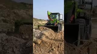 backhoe loader with bucket and grapple