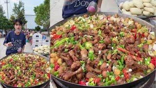 A Handsome Chinese Guy Cook Free Meals / Chicken Legs for the elders on the Street in a Village