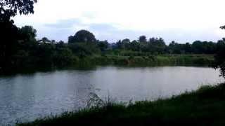 60 seconds of peace. Sunset prayers by the river. Chaibadan, Lamnarai, Thailand