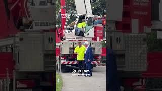 Crane operator sleeps as Trump meets his coworkers