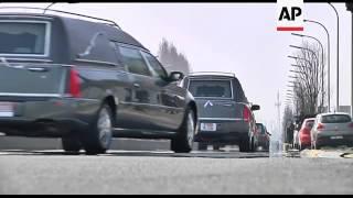 Convoy of hearses bearing bodies of bus crash victims leaves airport
