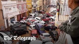 Spain flash floods: Dozens dead as cars pile up in Valencia