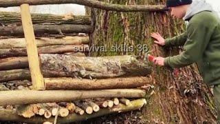 The builder of a wooden tower house on a hillside in the woods