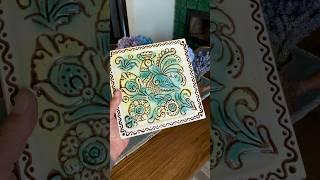 Folk motifs on the tile.