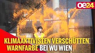 Klimaaktivisten verschütten Warnfarbe bei WU Wien