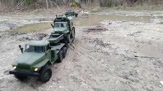 URAL 4320 with a URAL 4320 Radio Box loading on  Flat Bed Trailer in Off Road Action