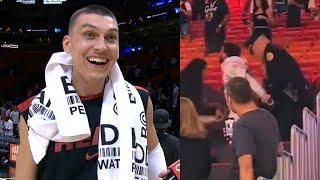 Tyler Herro gets distracted during interview by fans fighting in the crowd 