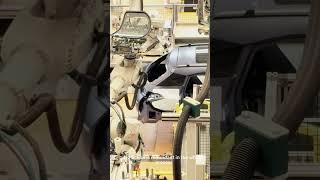 The beauty of modern technology: robotic arms install car glass