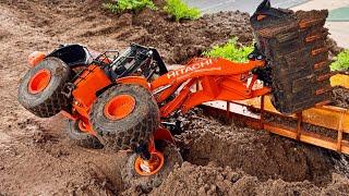 SUPER WHEEL LOADER RC HITACHI 370 ZW on a Construction site in the rain