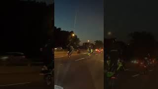 Multiple bikes doing wheelies at the same time