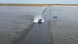 Mercedes tries to cross Holy Island causeway as it floods