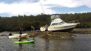 Boat (Bertram) Stuck On Rocks High & Dry Batemans Bay Australia