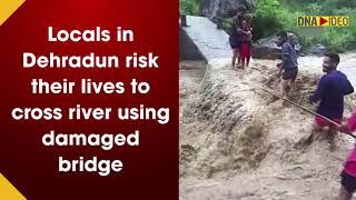 Locals in Dehradun risk their lives to cross river using damaged bridge