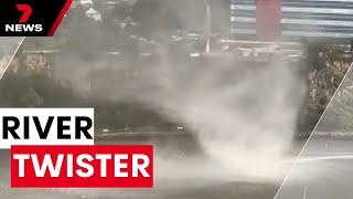 'Gustnado' whips up in Brisbane river during damaging storm | 7NEWS