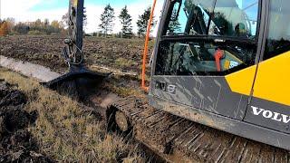 Digging A Ditch In A Large Pond