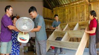 Making kitchen shelves. Knowing there was electricity, dad gave a fan to Phan and Chieu.