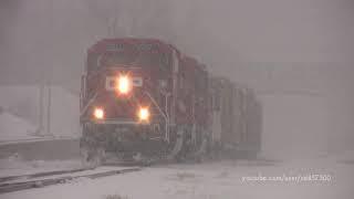 Spring Snow Storm with two new GP20C-ECOs and a Caboose