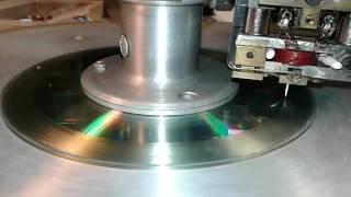 Embossing grooves on a CD