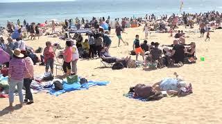 The beach at Bournemouth May bank holiday 2023. Visitors and residents enjoy sunny and warm weather.