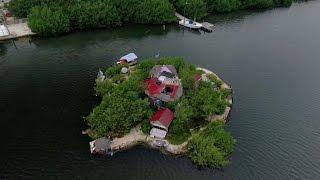 This Man Lives On An Island Paradise... Floating On Trash!