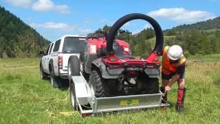 Unloading quad bike from a trailer