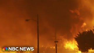 Fire blows up in Southern California, destroying homes and forcing thousands to evacuate