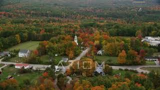 6K aerial video orbiting Webster Congregational Church, autumn, Webster, New Hampshire | AX151_135