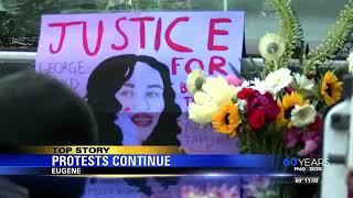 Protesters march for the 13th day in Eugene, shutting down Ferry Street Bridge