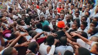 Levixone performing at a school in Jinja