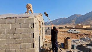 Love at its peak: Hussain and Jamila building the roof of their dream cottage