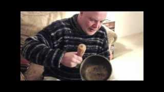 Paul Wilkinson playing a water singing bowl.