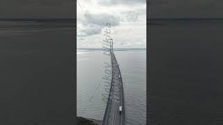 Vertical video. Korser, Denmark. Great Belt Bridge (Storeb?lt). Cloudy weather with gaps, Aerial ...