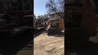 Skid steer ready to move stones off trailer and excavator ready to leave job #landscaping #landscape