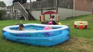 Boy Slips and Fall While Trying to Jump Into Inflatable Pool - 1533771