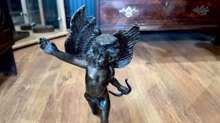 Bronze Cupid on a globe