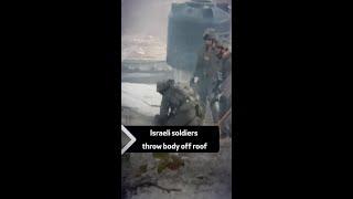 Israeli soldiers throw body off roof