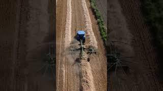 TRACTOR MAKES HAY STACK